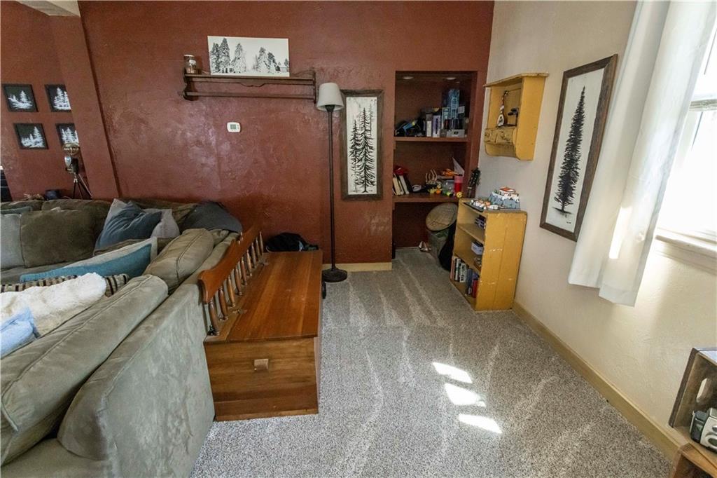 842 Anderson Street Confluence, PA 15424 - Photo 13 of 43 a living room with furniture and a flat screen tv