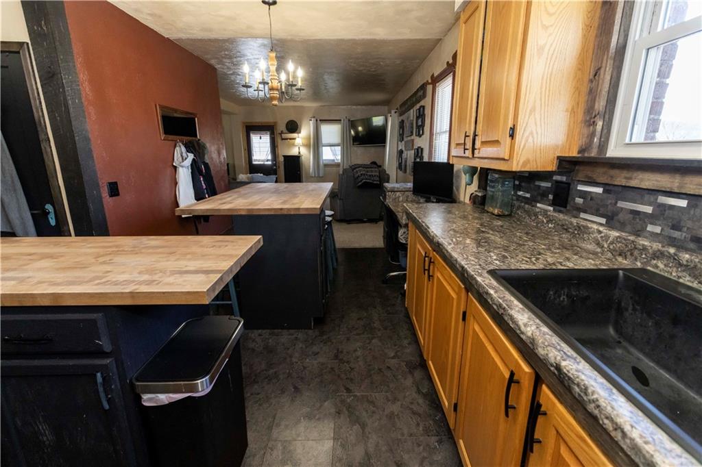 842 Anderson Street Confluence, PA 15424 - Photo 16 of 43 a kitchen with stainless steel appliances granite countertop wooden cabinets a stove top oven a sink and dishwasher