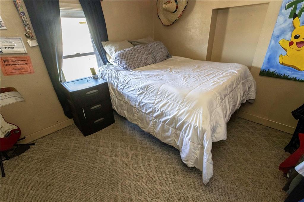 842 Anderson Street Confluence, PA 15424 - Photo 21 of 43 a bed sitting in a bedroom next to a window