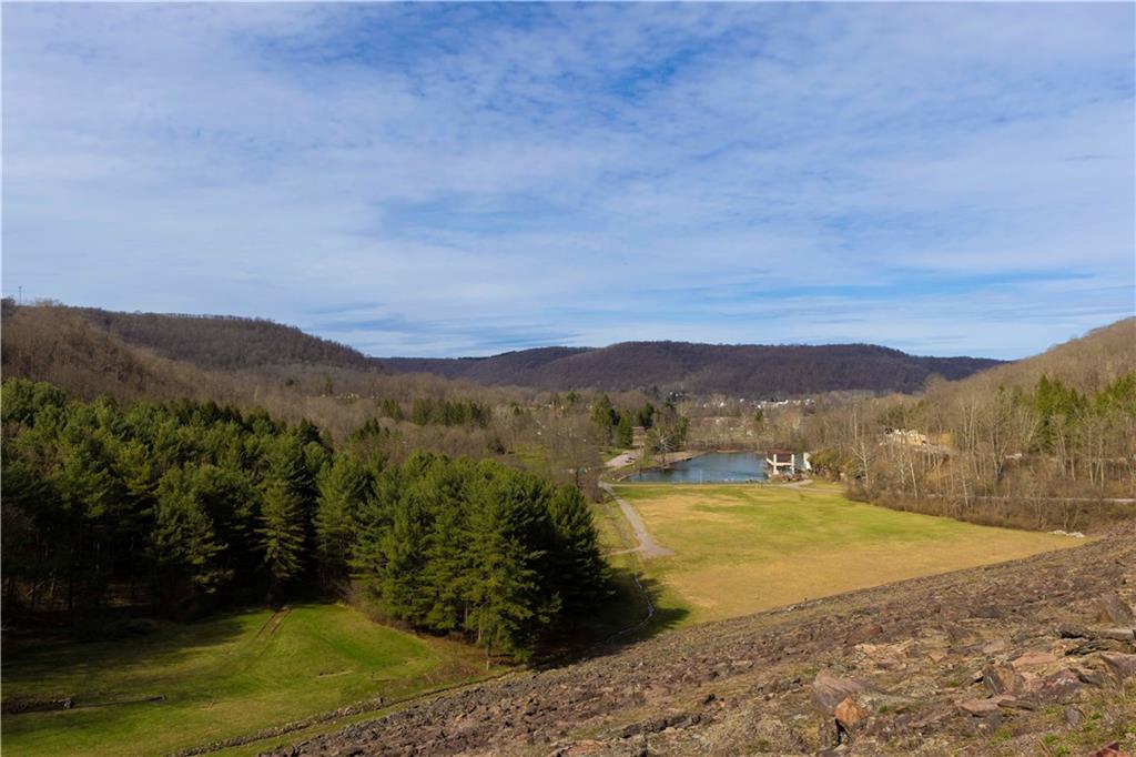 842 Anderson Street Confluence, PA 15424 - Photo 36 of 43 a view of a lake with a mountain in the background