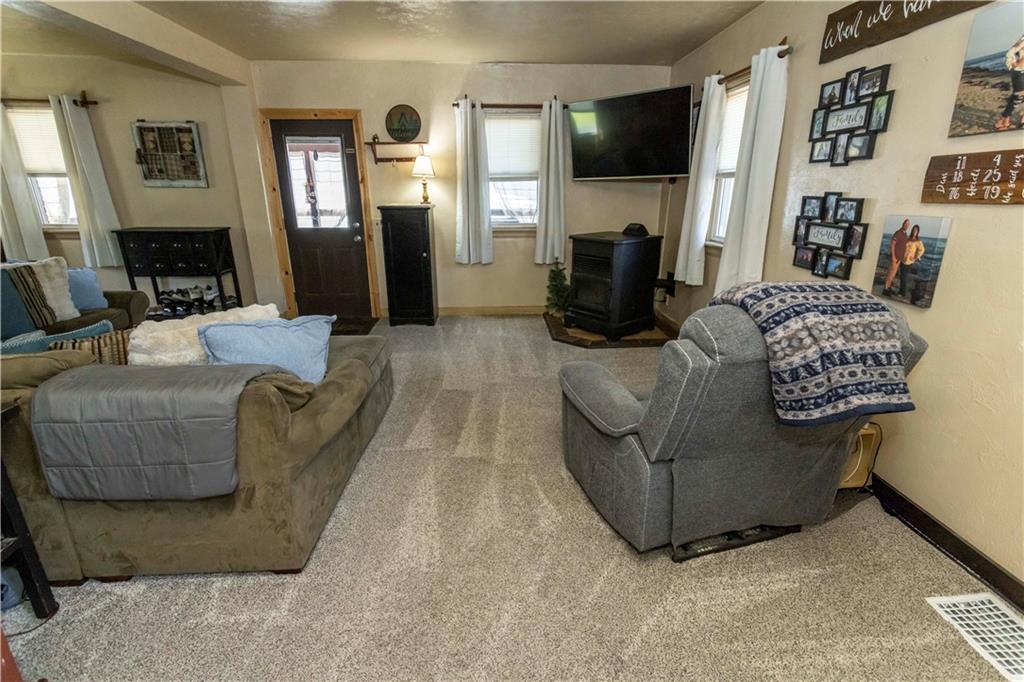 842 Anderson Street Confluence, PA 15424 - Photo 7 of 43 a living room with furniture and a flat screen tv