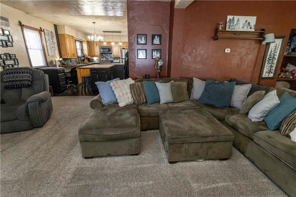 842 Anderson Street Confluence, PA 15424 - Photo 10 of 43 a living room with furniture and a flat screen tv