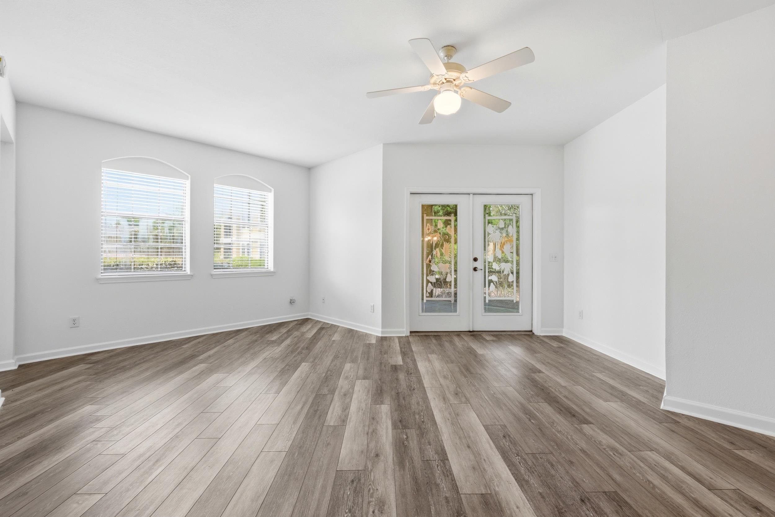 2500 Vista Cove Road St. Augustine, FL 32084 - Photo 19 of 53 wooden floor in an empty room with a window