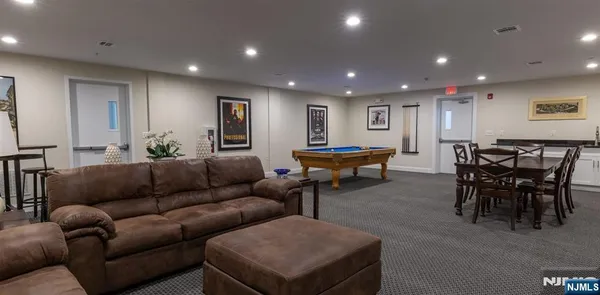 a room with gym equipment and a view of living room