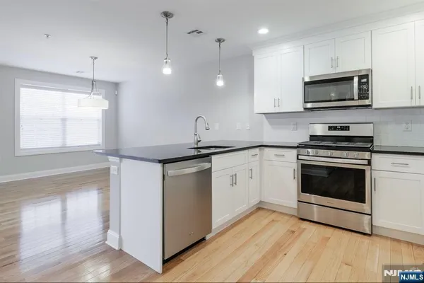 a view of a kitchen with a sink and a kitchen
