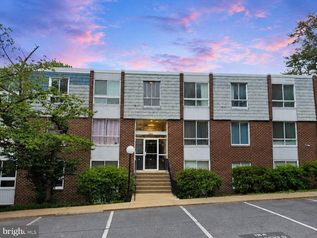 3934 Bel Pre Road, Unit 39342 Silver Spring, MD 20906 - Photo 1 of 30 front view of a house with a yard