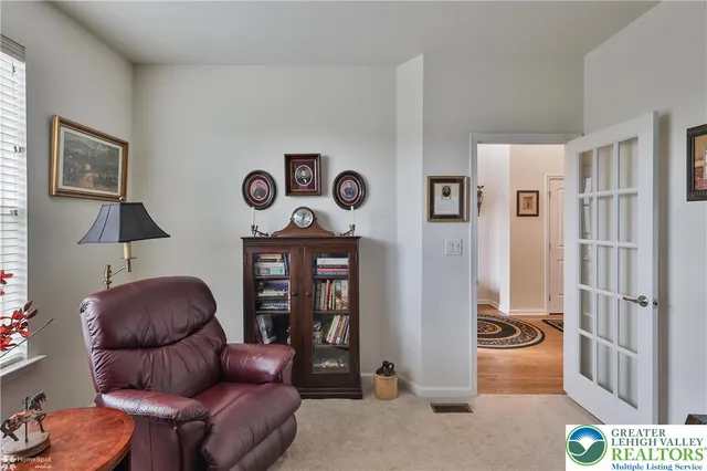 a living room with a couch and a fireplace