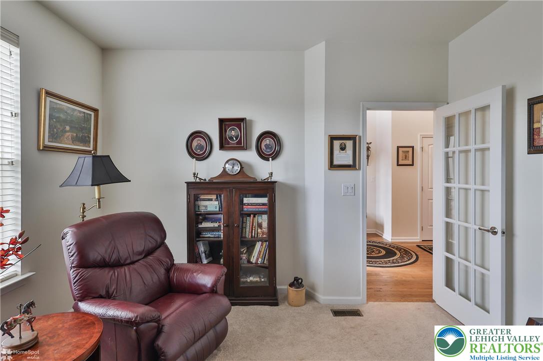 4109 Eveningstar Road Emmaus, PA 18049 - Photo 11 of 57 a living room with furniture a rug and a window