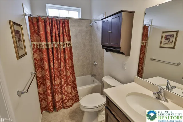 a bedroom with a bed and cabinets