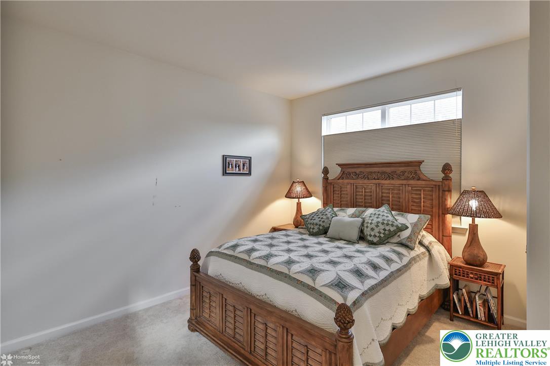 4109 Eveningstar Road Emmaus, PA 18049 - Photo 13 of 57 a living room with a couch and a fireplace