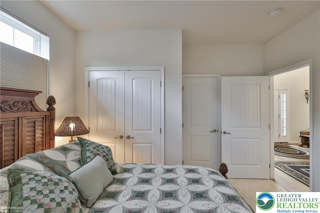 4109 Eveningstar Road Emmaus, PA 18049 - Photo 14 of 57 a bedroom with a bed and cabinets