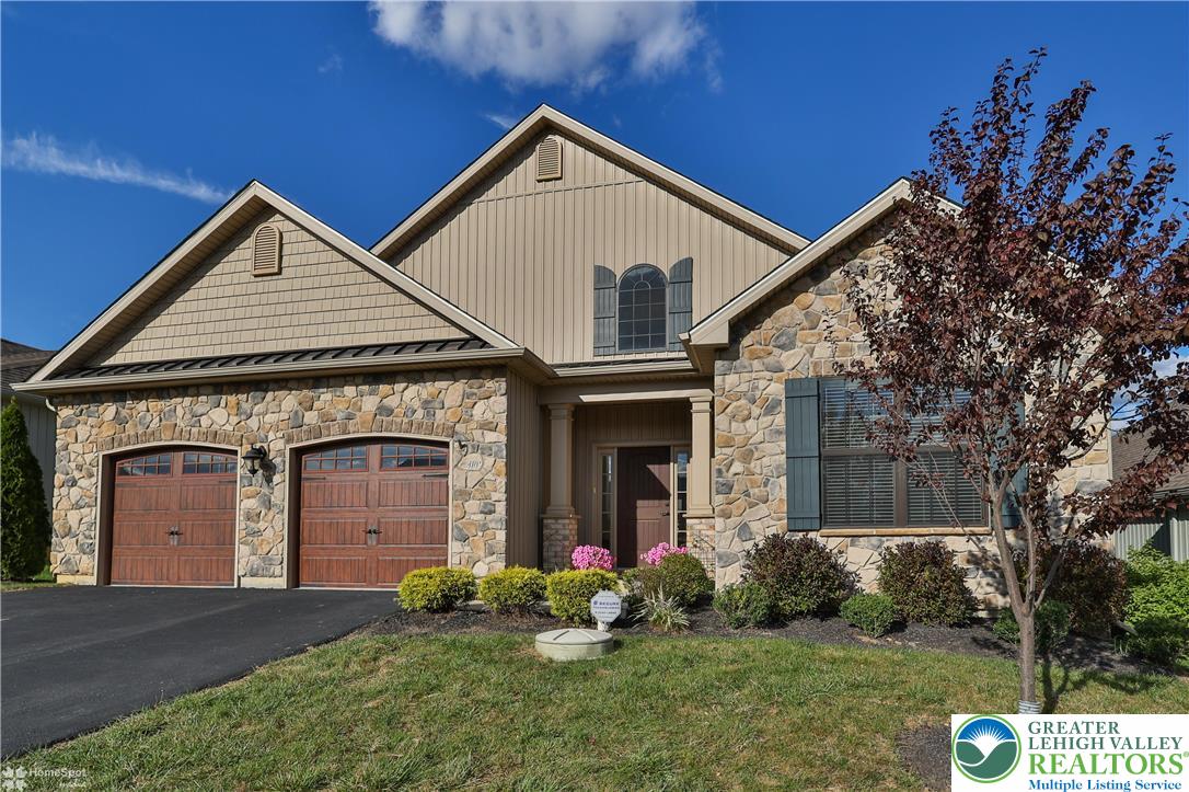 4109 Eveningstar Road Emmaus, PA 18049 - Photo 2 of 57 a front view of a house with garden