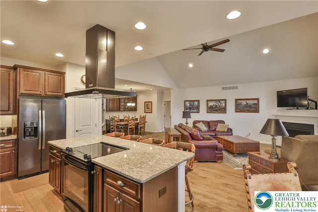 a bedroom with bed and wooden floor