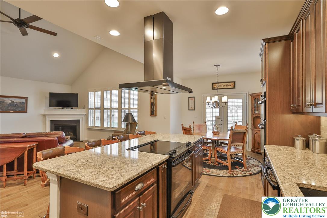 4109 Eveningstar Road Emmaus, PA 18049 - Photo 29 of 57 a view of a a dining room with furniture window and wooden floor