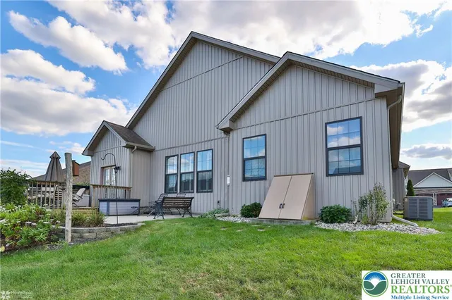 a view of backyard with garden and deck