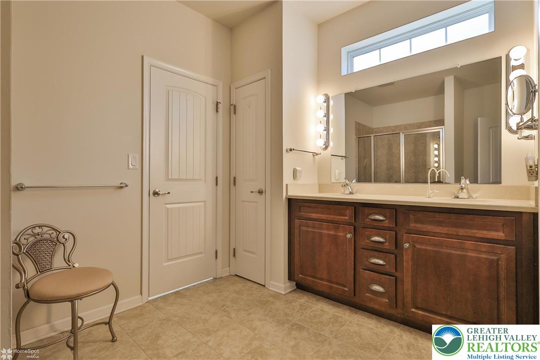 4109 Eveningstar Road Emmaus, PA 18049 - Photo 33 of 57 a bathroom with a granite countertop sink and a mirror
