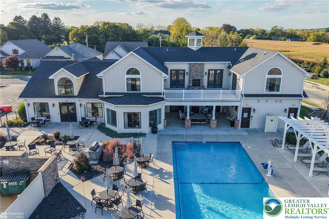 4109 Eveningstar Road Emmaus, PA 18049 - Photo 48 of 57 a view of house with a swimming pool and outdoor seating