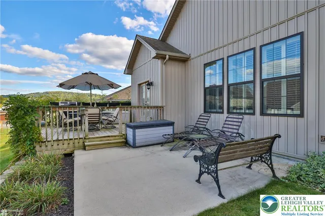 a house view with a sitting space and garden