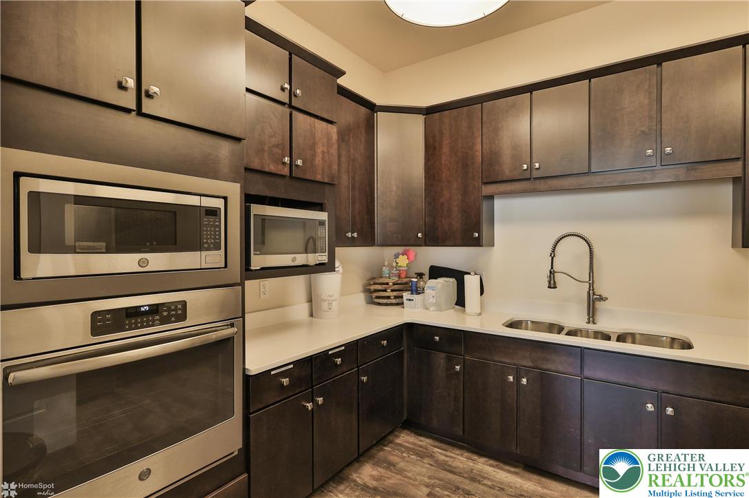 4109 Eveningstar Road Emmaus, PA 18049 - Photo 55 of 57 a kitchen with stainless steel appliances a sink and cabinets