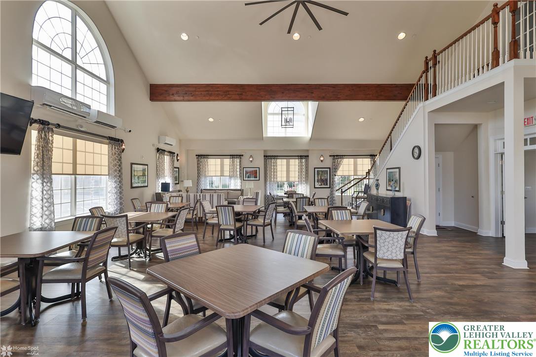 4109 Eveningstar Road Emmaus, PA 18049 - Photo 57 of 57 a view of a dining room with furniture window and wooden floor