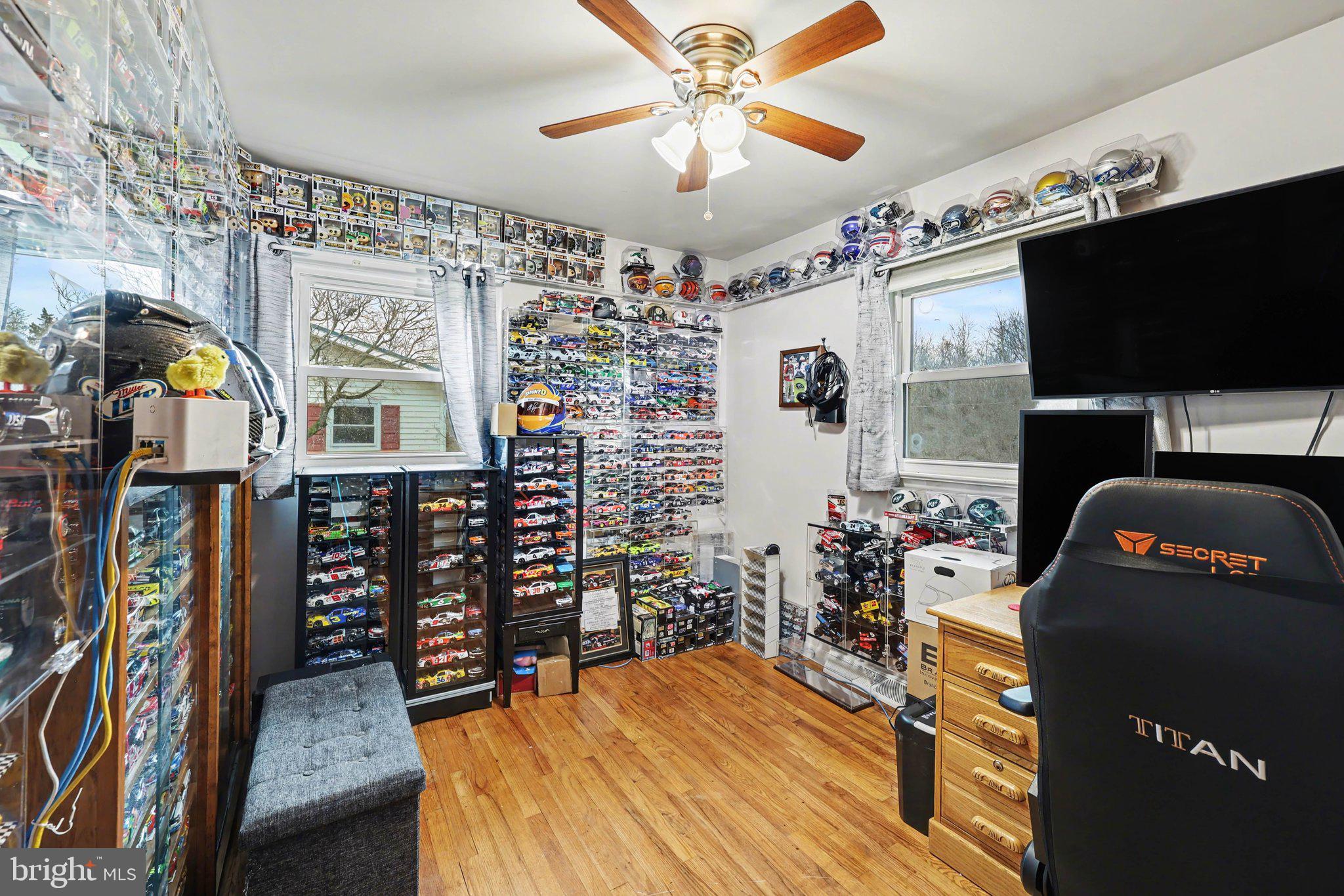 109 Adams Road Carlisle, PA 17015 - Photo 16 of 29 a bedroom with furniture and a flat screen tv