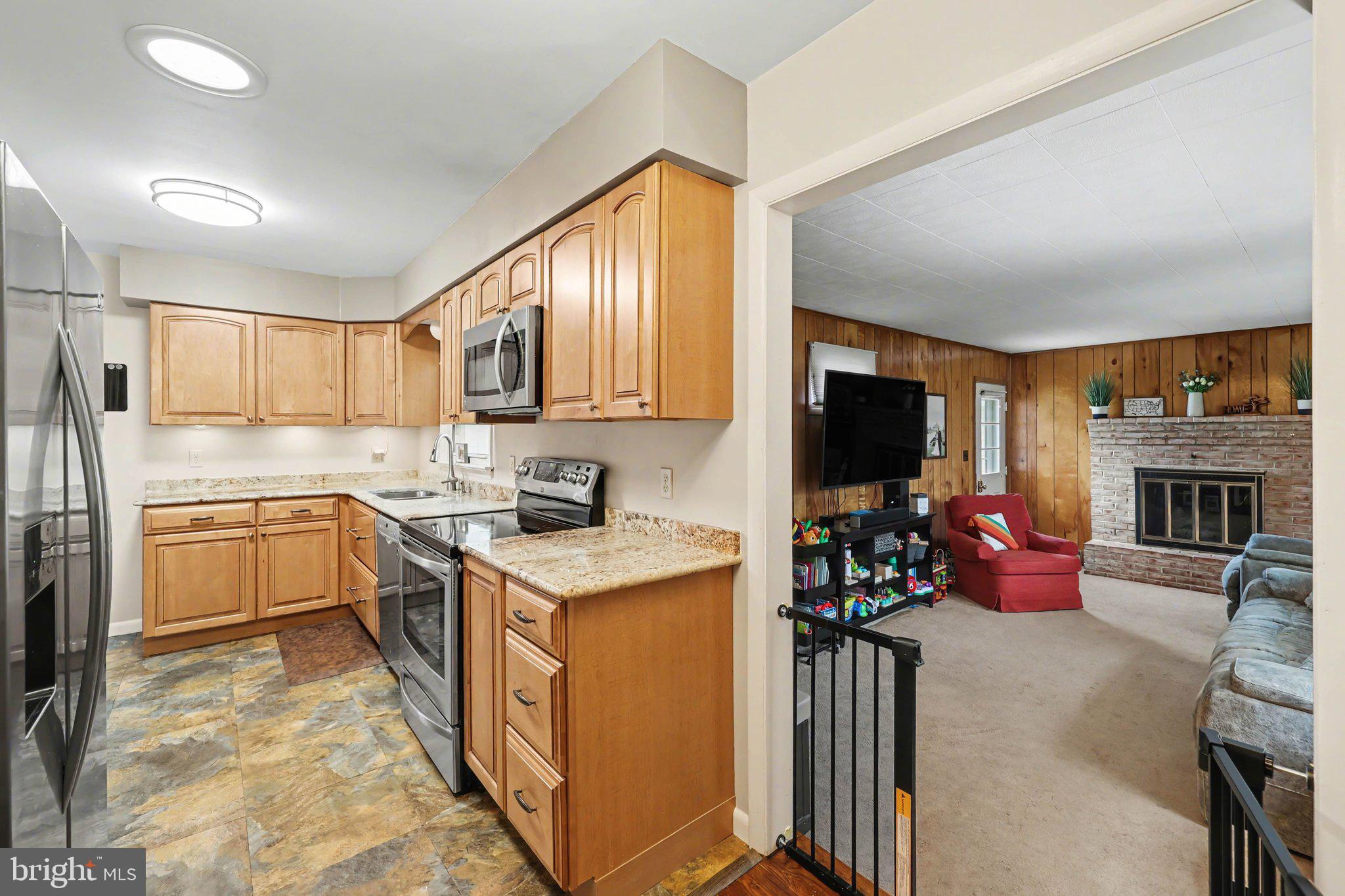 109 Adams Road Carlisle, PA 17015 - Photo 5 of 29 a kitchen with a sink stove top oven and refrigerator