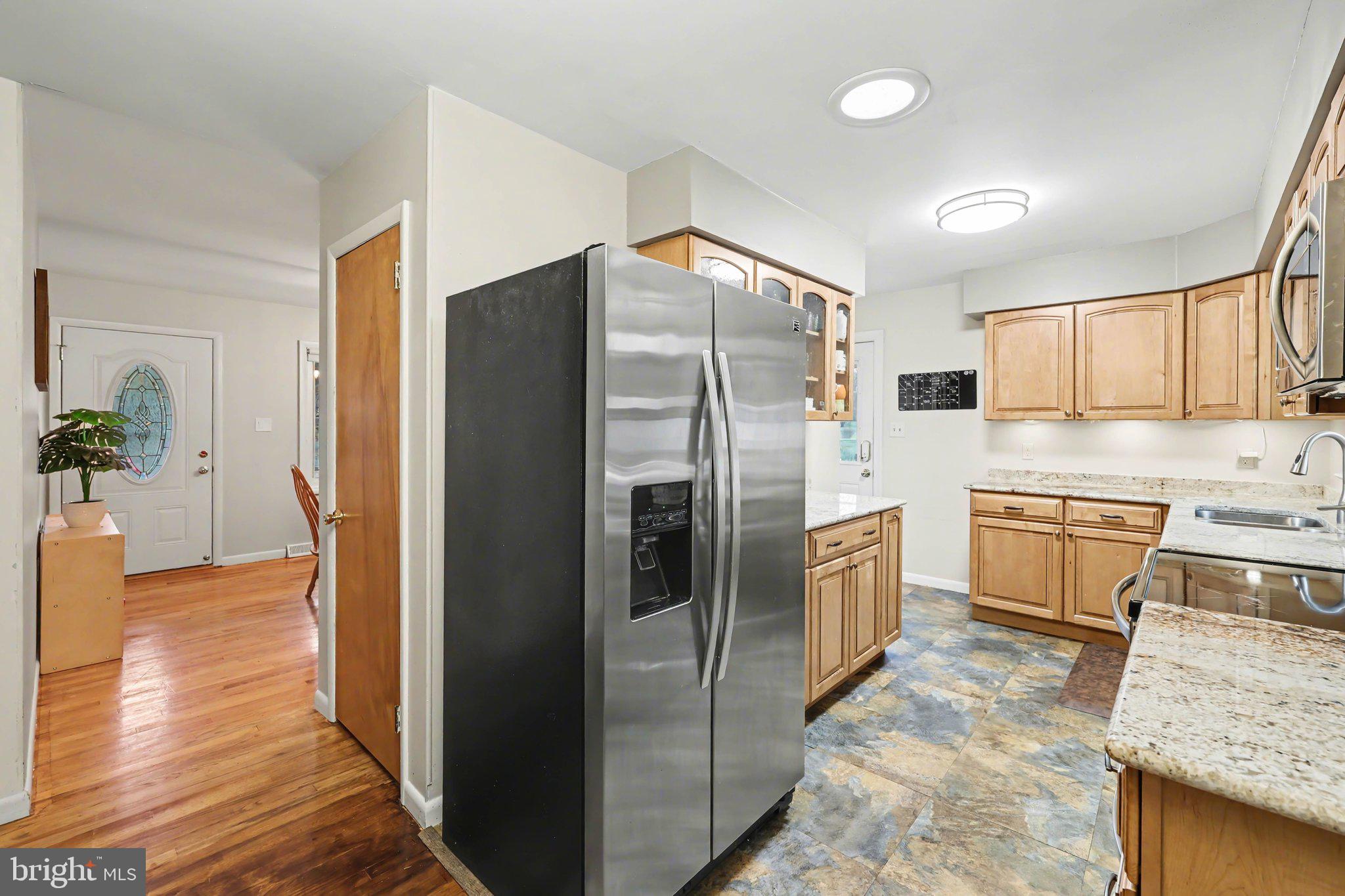109 Adams Road Carlisle, PA 17015 - Photo 6 of 29 a kitchen with a refrigerator and a sink