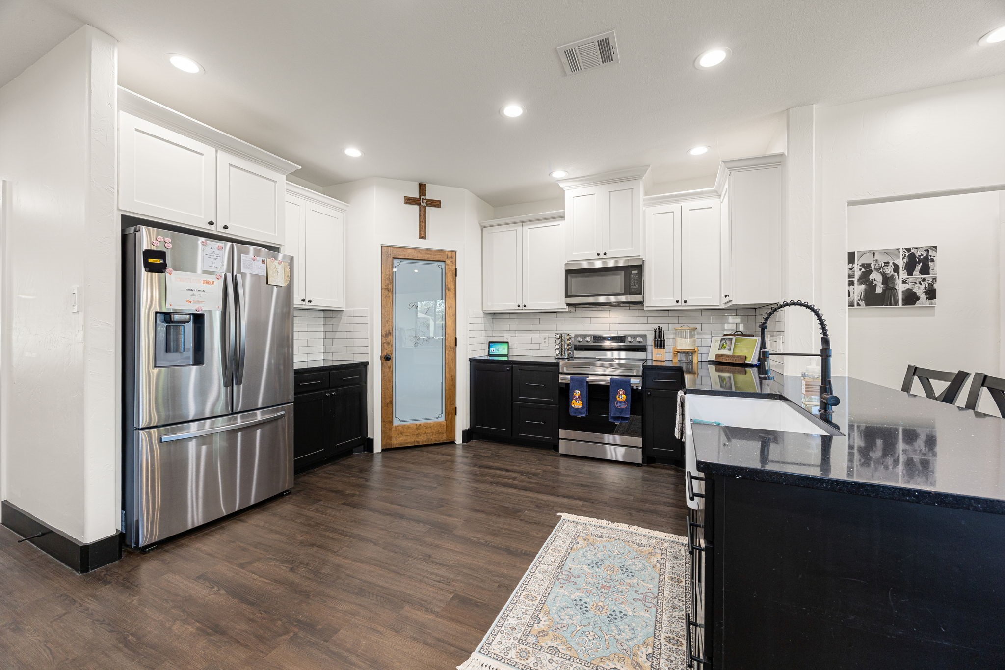 24571 Armagh Road Hempstead, TX 77445 - Photo 11 of 45 a kitchen with kitchen island granite countertop stainless steel appliances and a sink