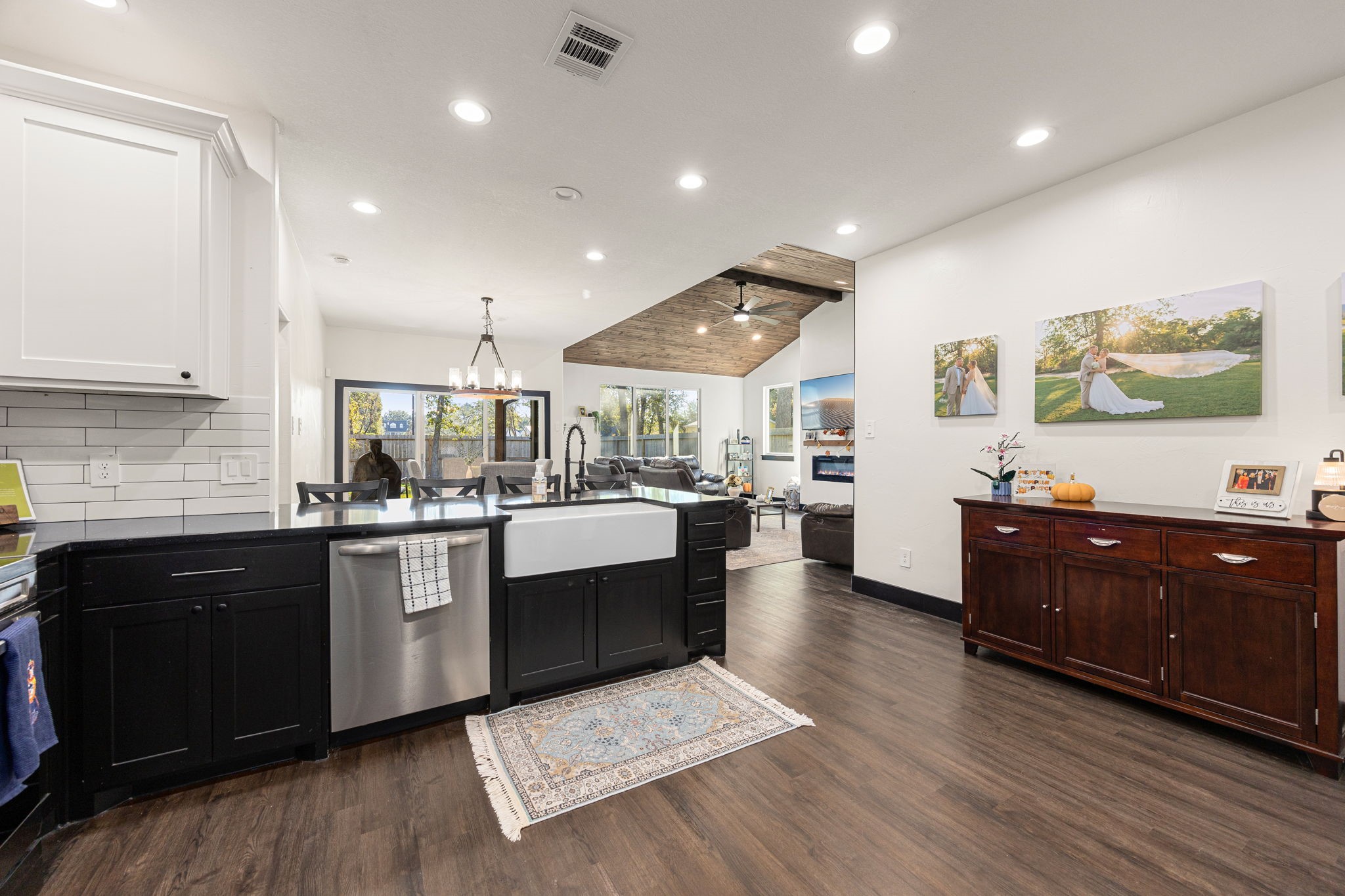 24571 Armagh Road Hempstead, TX 77445 - Photo 14 of 45 a large kitchen with stainless steel appliances granite countertop a large stove a sink dishwasher and a refrigerator with wooden floor