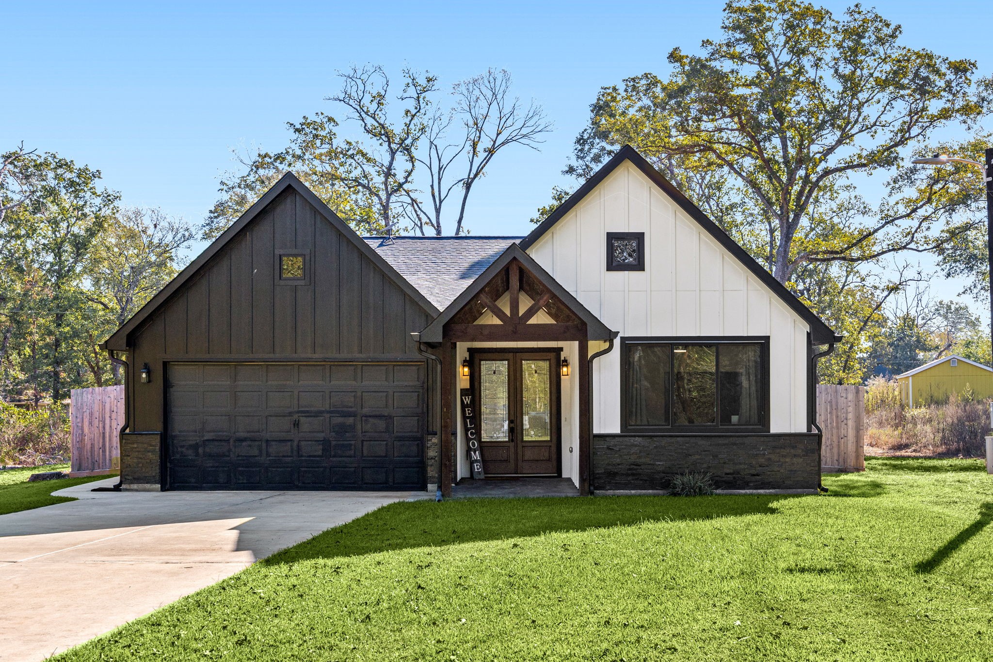 24571 Armagh Road Hempstead, TX 77445 - Photo 3 of 45 a front view of a house with a yard and garage
