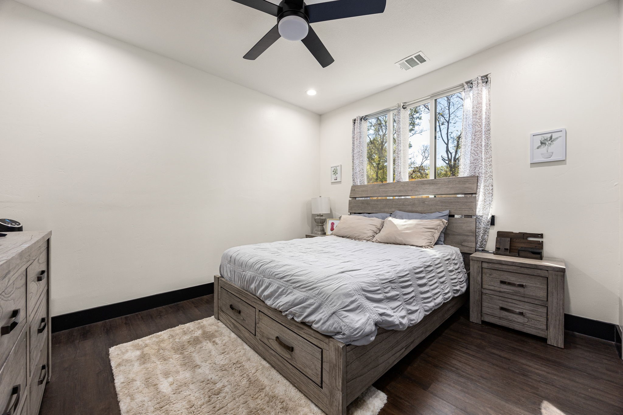 24571 Armagh Road Hempstead, TX 77445 - Photo 31 of 45 a bedroom with a bed and wooden floor