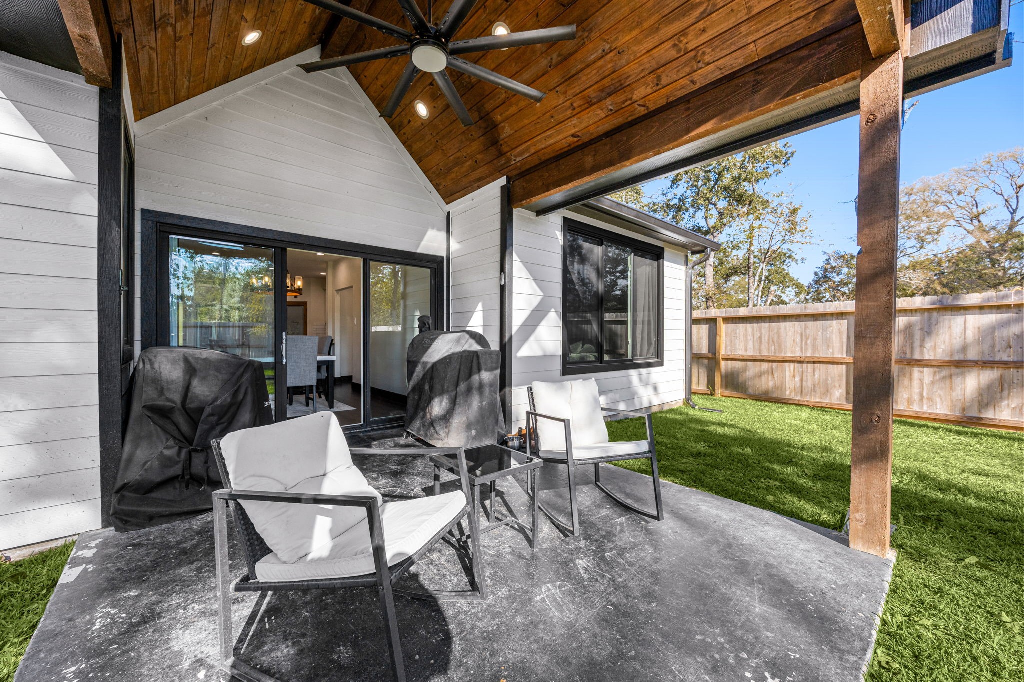 24571 Armagh Road Hempstead, TX 77445 - Photo 36 of 45 a view of a porch with chairs and backyard