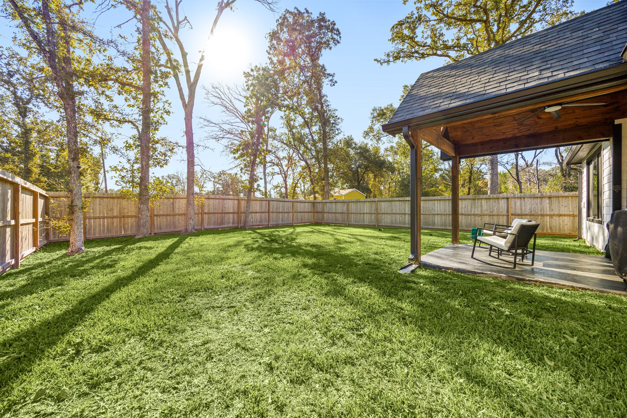 24571 Armagh Road Hempstead, TX 77445 - Photo 38 of 45 a view of backyard with a slide and trees