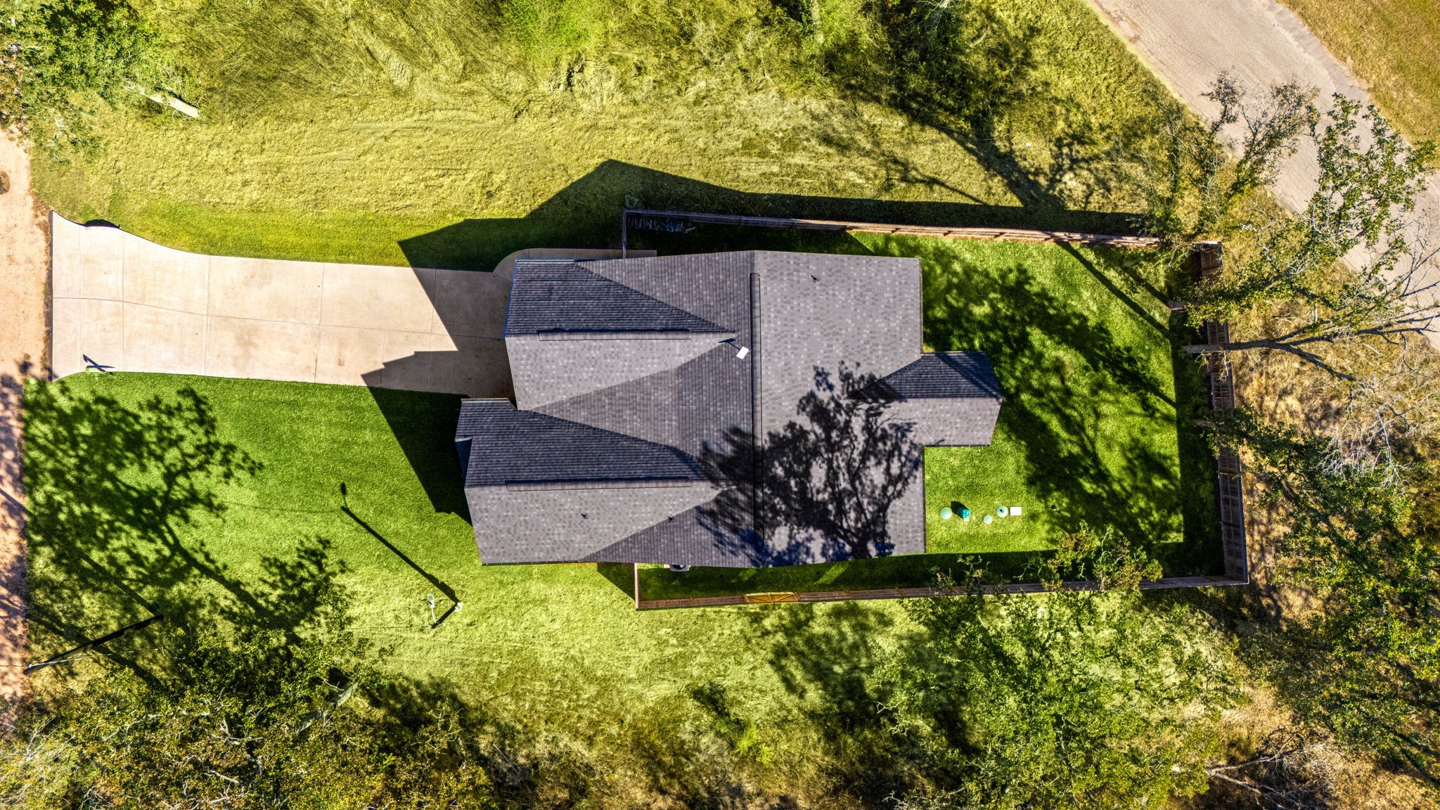 24571 Armagh Road Hempstead, TX 77445 - Photo 43 of 45 an aerial view of a house with a yard basket ball court and outdoor seating