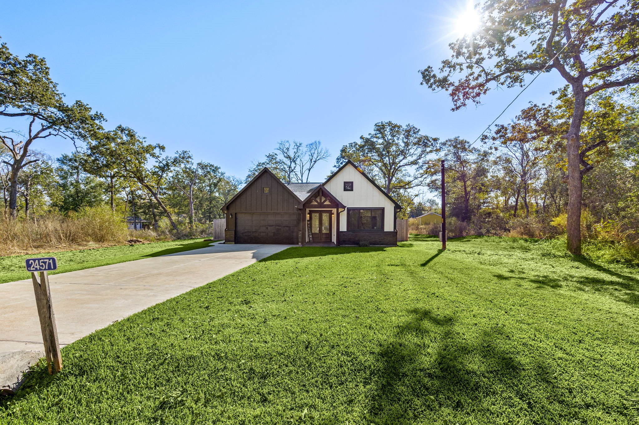 24571 Armagh Road Hempstead, TX 77445 - Photo 5 of 45 a front view of a house with garden