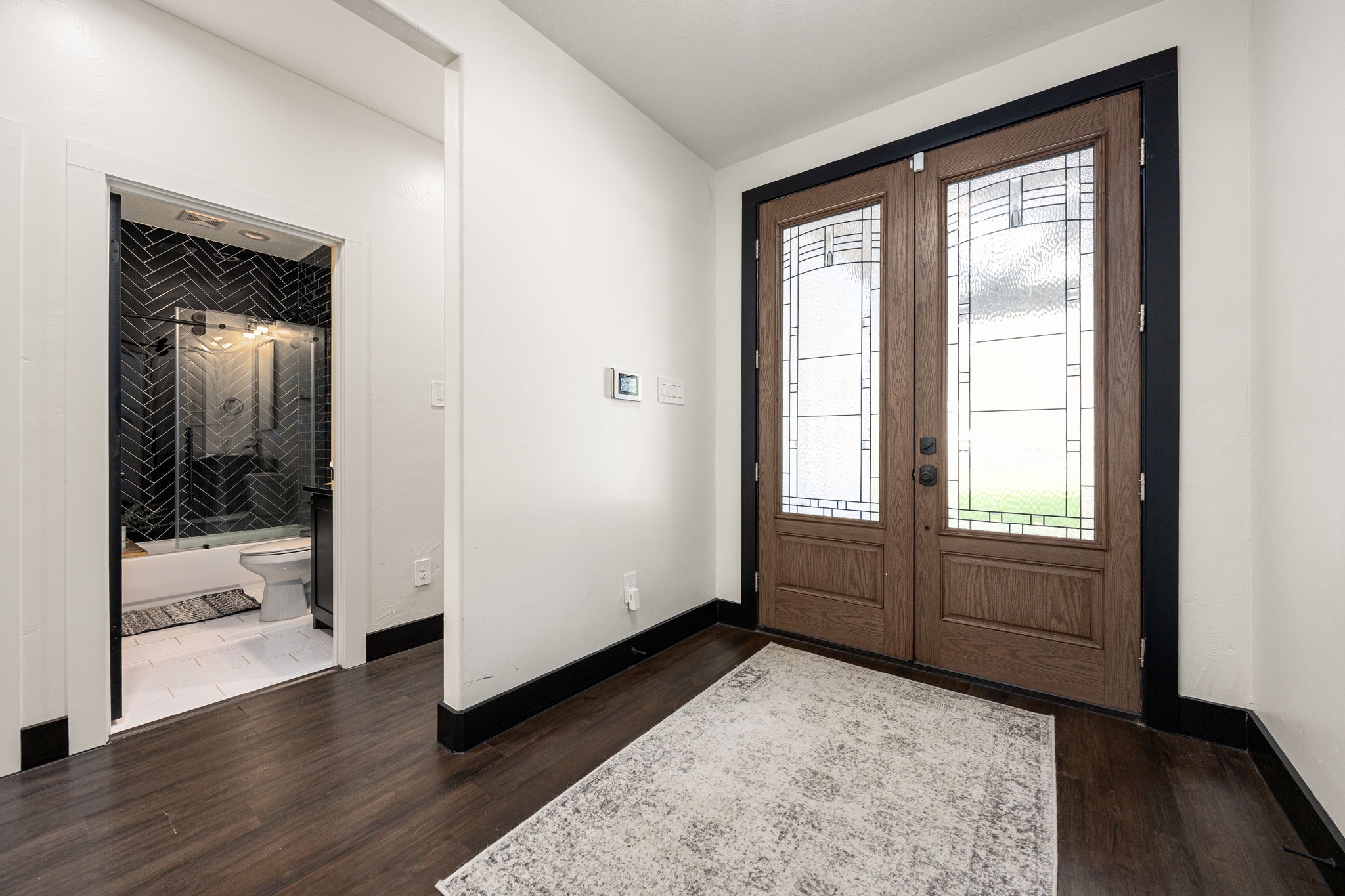 24571 Armagh Road Hempstead, TX 77445 - Photo 7 of 45 a view of an empty room with wooden floor and a window