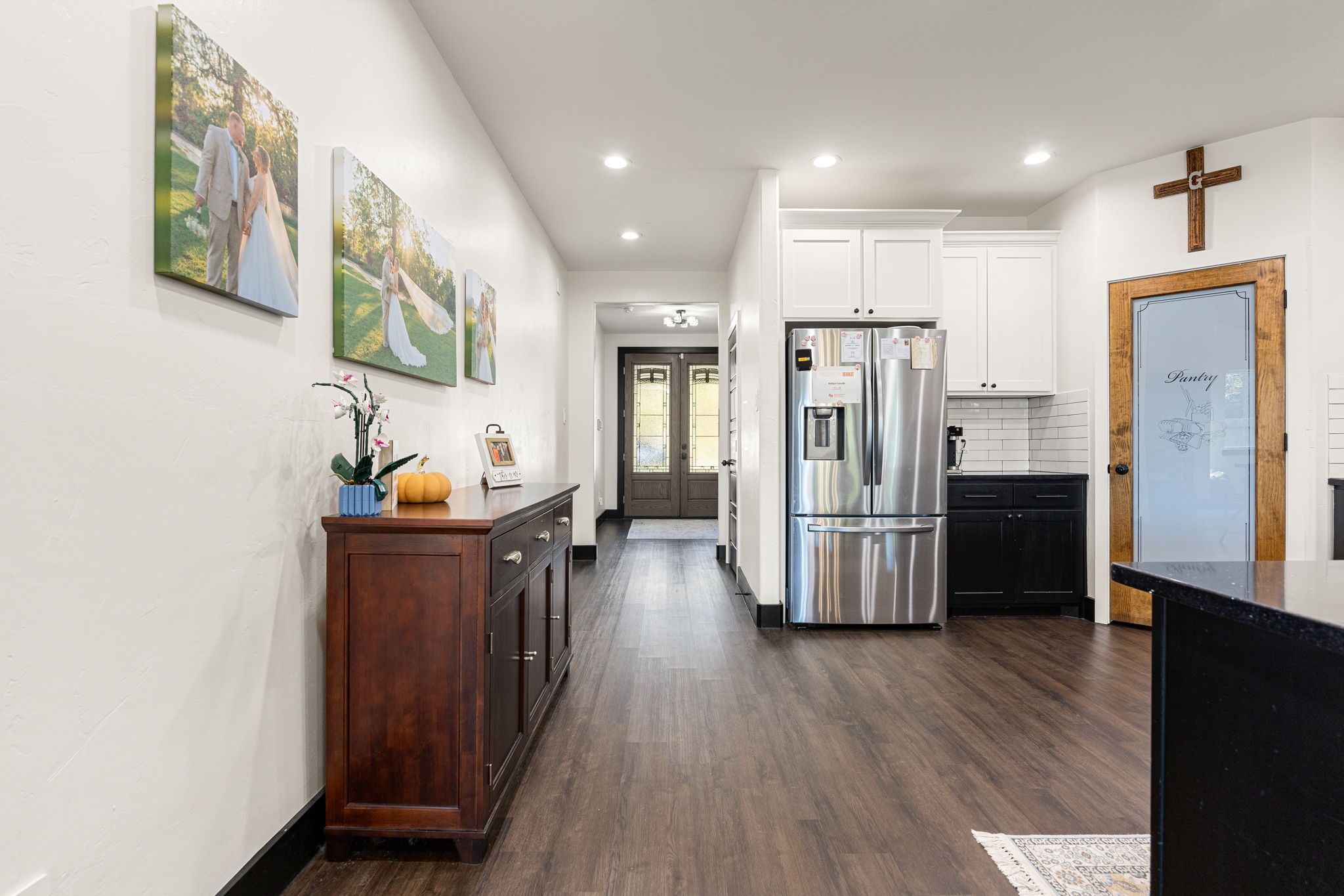 24571 Armagh Road Hempstead, TX 77445 - Photo 8 of 45 a kitchen with stainless steel appliances wooden floor and chandelier