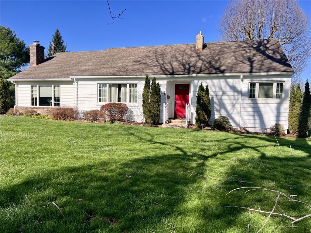 a view of house with a big yard