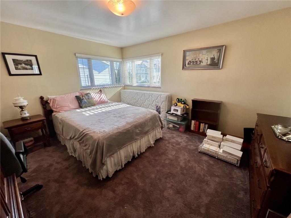 280 Derrick Avenue Uniontown, PA 15401 - Photo 20 of 28 a bedroom with a bed table chair and a window