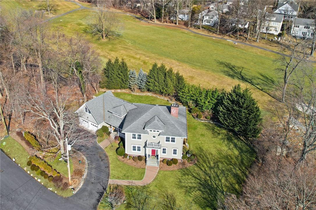 Front of home surrounded by golf course
