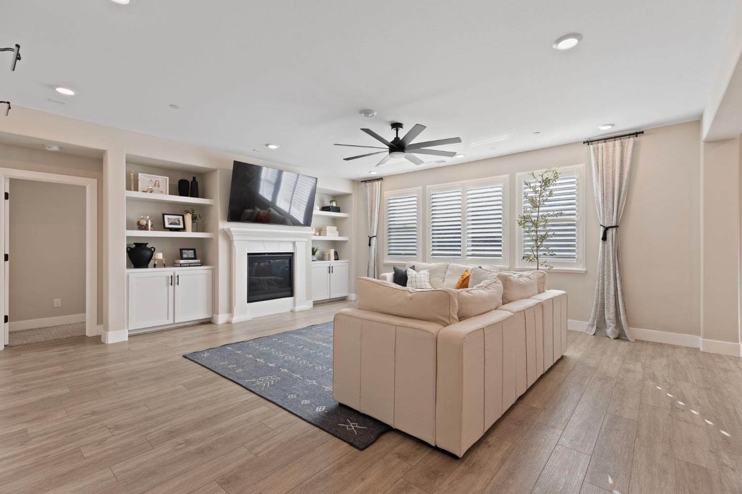2948 Laredo Drive Rocklin, CA 95765 - Photo 11 of 54 a living room with furniture and a fireplace