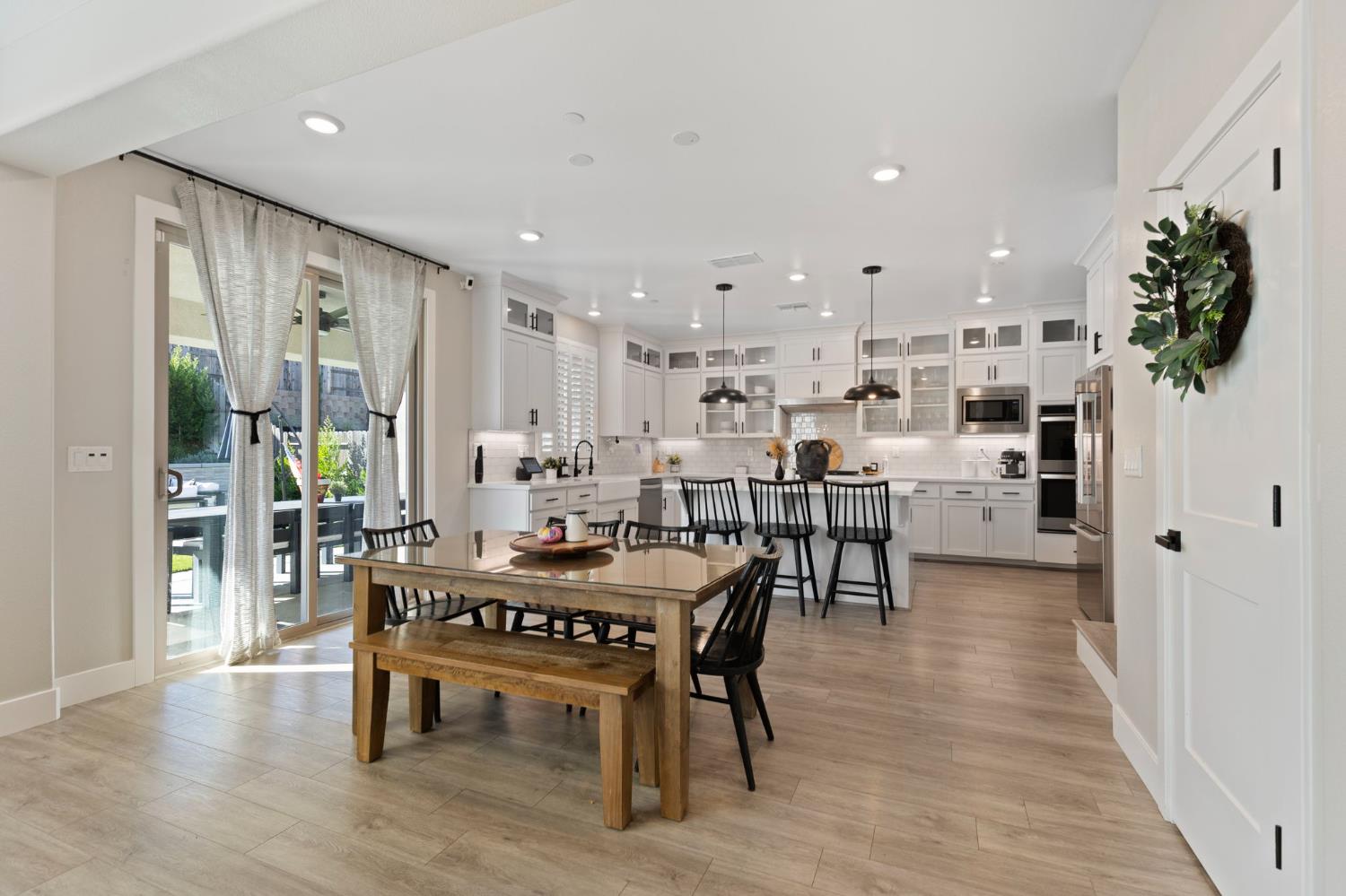 2948 Laredo Drive Rocklin, CA 95765 - Photo 16 of 54 a living room with stainless steel appliances furniture wooden floor and a kitchen view