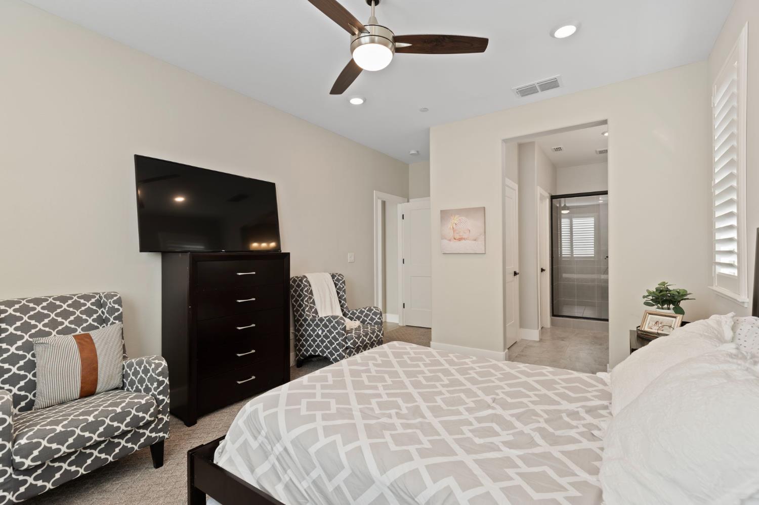 2948 Laredo Drive Rocklin, CA 95765 - Photo 25 of 54 a bedroom with a bed and ceiling fan