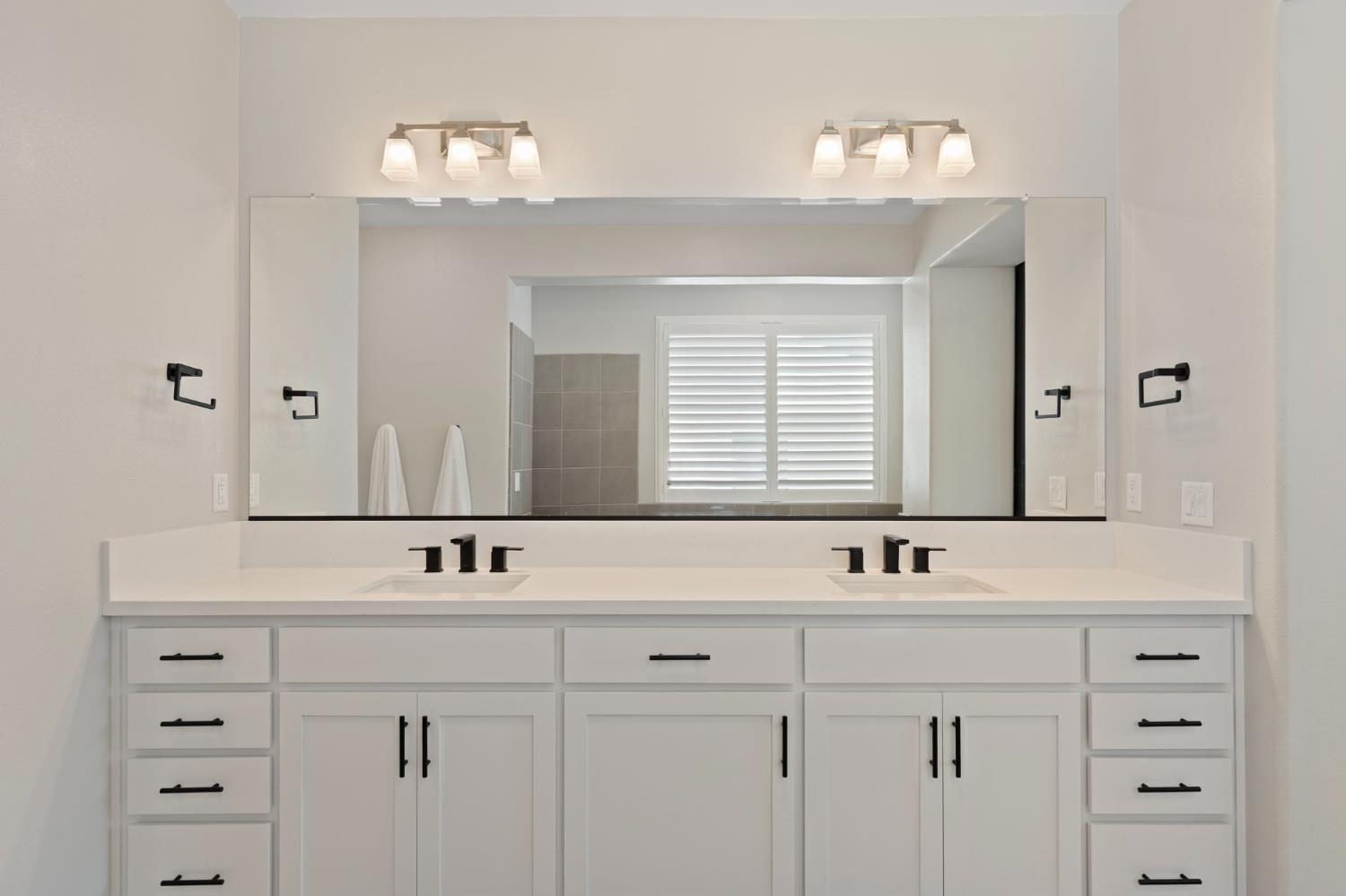 2948 Laredo Drive Rocklin, CA 95765 - Photo 30 of 54 a bathroom with a sink vanity and a mirror