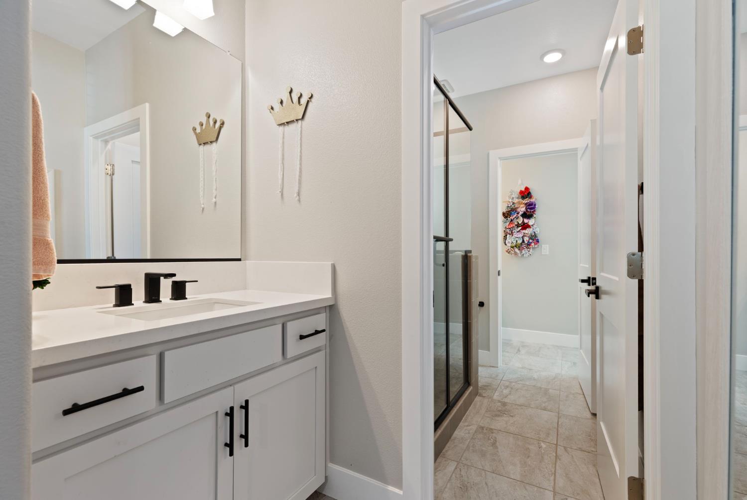 2948 Laredo Drive Rocklin, CA 95765 - Photo 40 of 54 a bathroom with a sink vanity and a mirror