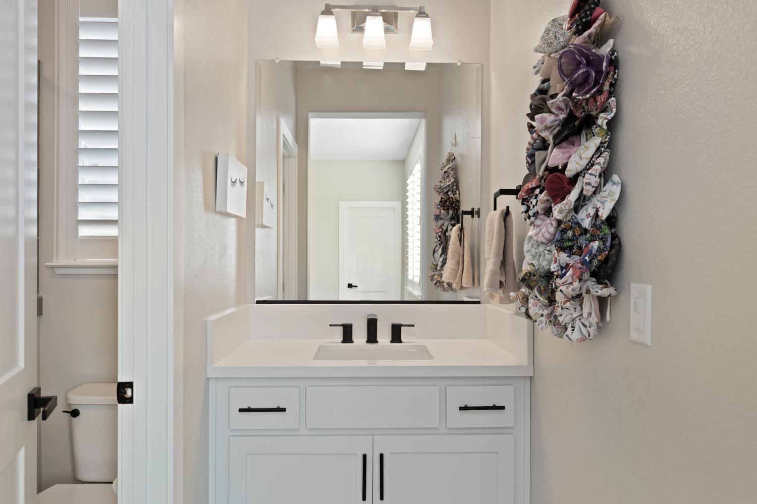 2948 Laredo Drive Rocklin, CA 95765 - Photo 41 of 54 a bathroom with a sink and a mirror