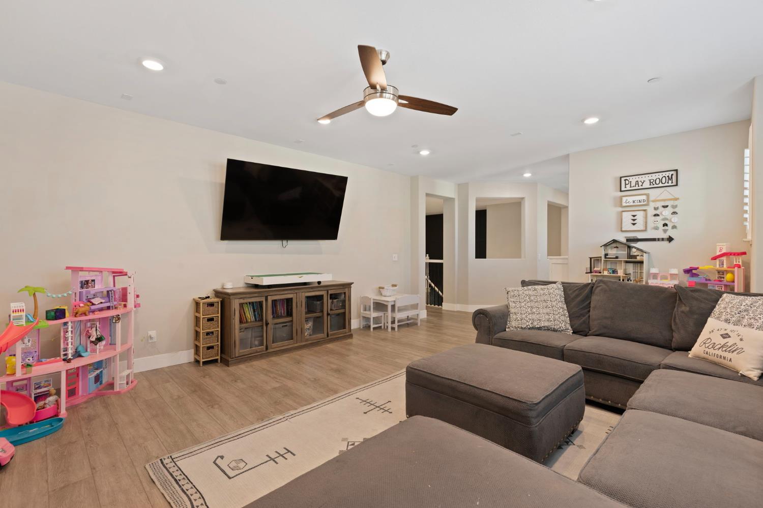 2948 Laredo Drive Rocklin, CA 95765 - Photo 44 of 54 a living room with furniture and a flat screen tv