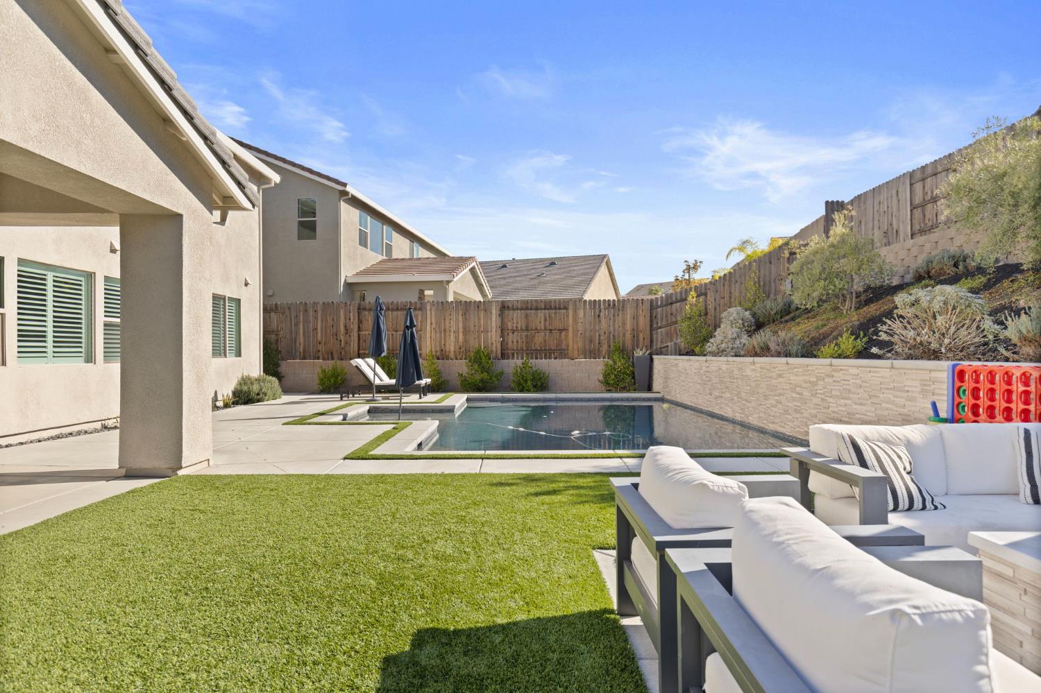 2948 Laredo Drive Rocklin, CA 95765 - Photo 47 of 54 a view of a house with swimming pool and sitting area