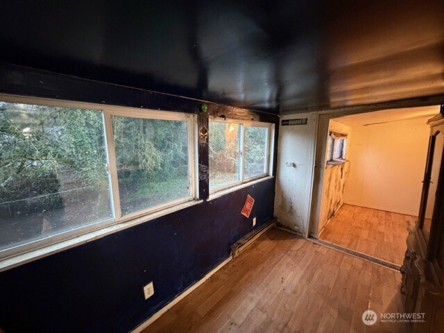 8915 10th Avenue South Seattle, WA 98108 - Photo 17 of 23 a view of a porch with wooden floor and furniture