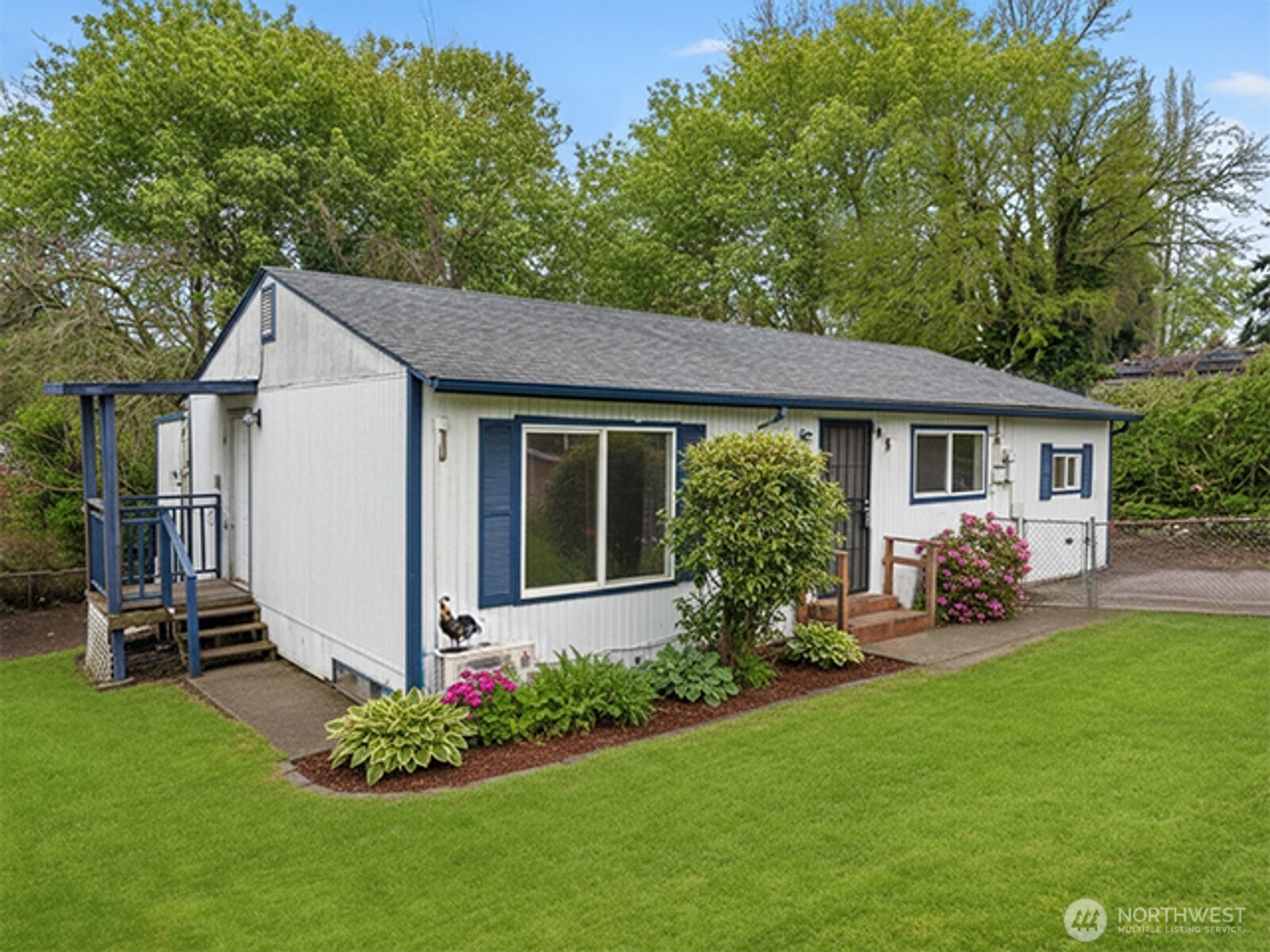 8915 10th Avenue South Seattle, WA 98108 - Photo 19 of 23 a front view of a house with a garden and porch